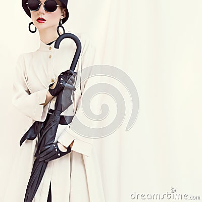 Styled fashion girl with umbrella. glamorous portrait Stock Photo