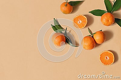 Styled stock photo. Decorative summer fruit composition. Whole and sliced orange tangerines, citrus fruit and leaves Stock Photo