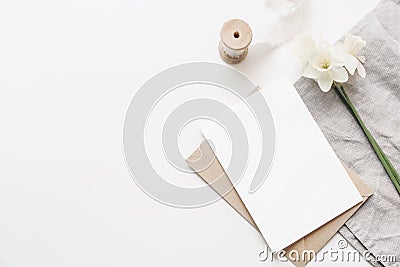 Styled stock photo. Spring, Easter composition with narcissus, daffodils flowers and linen napkin isolated on white Stock Photo