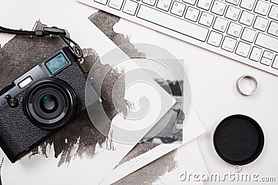 Styled tabletop with computer keyboard and retro camera on white Stock Photo