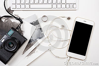 Styled tabletop with computer keyboard, smartphone and retro cam Stock Photo