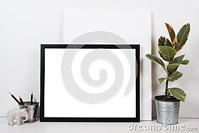 Styled tabletop, empty frame, painting art poster interior mock- Stock Photo