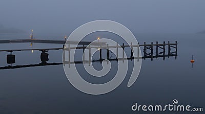 Stylish art pier in fog Stock Photo