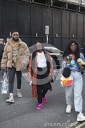 Stylish attendees gathering outside 180 The Strand for London Fashion Week Editorial Stock Photo