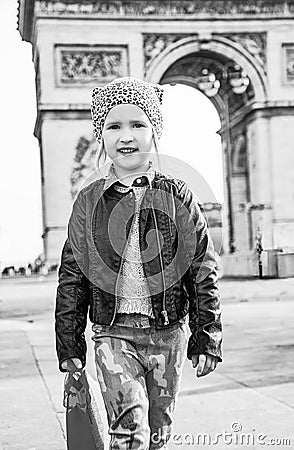 Girl near Arc de Triomphe in Paris, France going forward Stock Photo