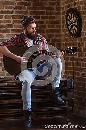 Stylish bearded musician Stock Photo
