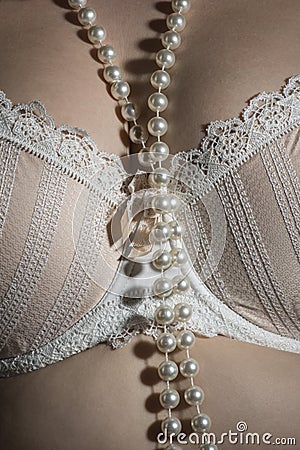 Stylish, beige bra with pearls Stock Photo