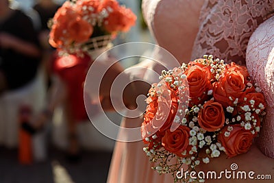 Stylish bridesmaids in pink lace dress holding amazing bouquets Stock Photo