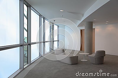 Stylish, bright room with large windows Stock Photo