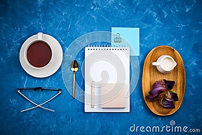 Stylish business flatlay mockup with knolled cup of black tea, notebook, glasses and pencil Stock Photo