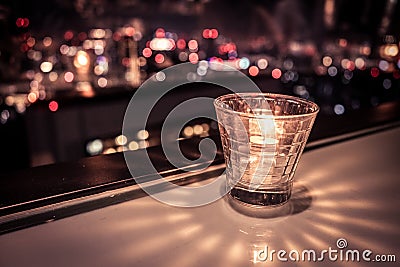 Stylish candle and the city of night view Stock Photo