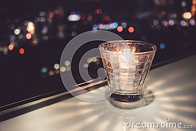 Stylish candle and the city of night view Stock Photo