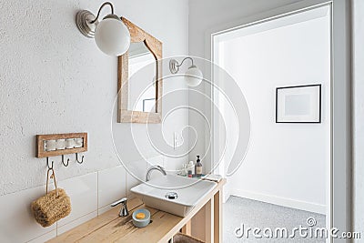 Ceramic sink on trendy wooden console table in small elegant bathroom Stock Photo