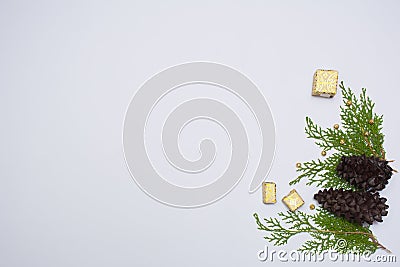Stylish christmas composition. fir branches, cones and christmas gifts on white background. flat lay top view. Stock Photo