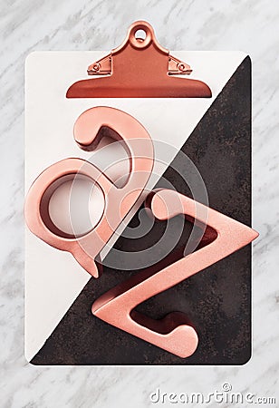 Stylish clipboard with metal rose gold letters Stock Photo