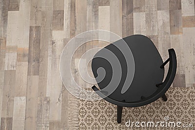 Stylish comfortable black chair on floor, top view. Space for text Stock Photo
