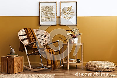 Stylish composition of living room interior with design rattan armchair, two mock up poster frames, plants, cube. Stock Photo