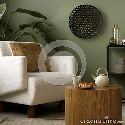 Stylish composition of living room interior with green wall, grey sofa with grey pillow. White armchair with brown pilow, wooden Stock Photo