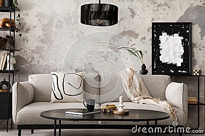 The stylish compostion at living room interior with design gray sofa, armchair, black coffee table, lamp and elegant personal Stock Photo