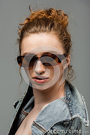 Stylish and confident young redhead model Stock Photo