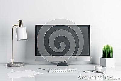 Stylish designer desktop with empty computer screen and lamp on table Editorial Stock Photo