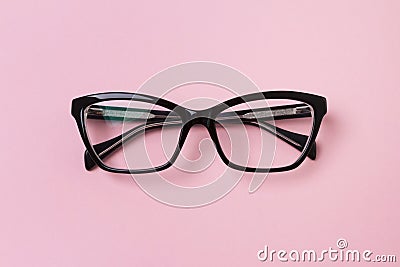 Stylish fashionable glasses on creative pink background Stock Photo