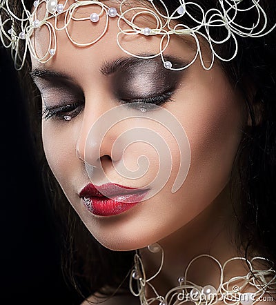 Stylish Fashionable Young Woman with Pearls in Reverie Stock Photo