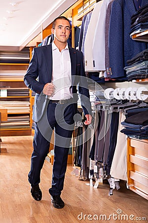 Stylish fine man visiting men clothes store Stock Photo