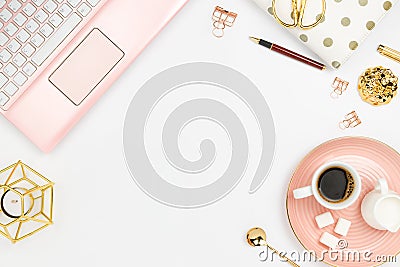 Stylish flatlay frame arrangement with pink laptop, coffee, milk holder, planner, glasses and other accessories Stock Photo