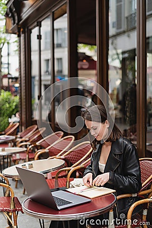 stylish freelancer in black leather jacket Stock Photo