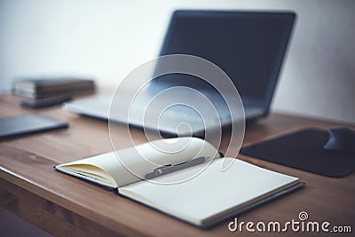 Stylish freelancer workspace with laptop open notepad work tools at home or studio office workplace Stock Photo