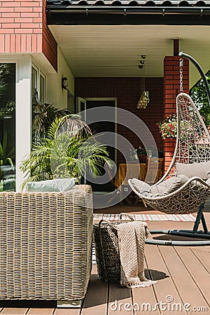 Stylish garden decoration with fancy egg chair and garden furniture Stock Photo