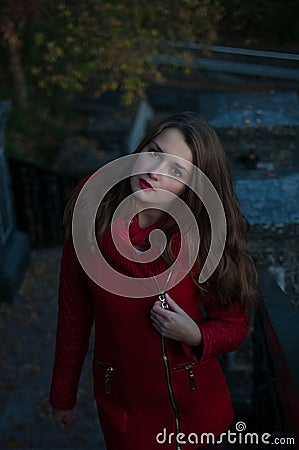 Stylish girl, beautiful outer face in a coat on an autumn cool day Stock Photo