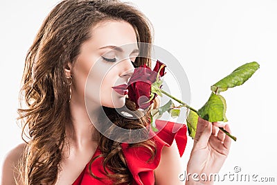 stylish girl sniffing rose with closed eyes Stock Photo