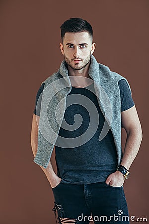 Stylish handsome man portrait on brown background Stock Photo