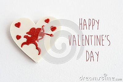 stylish heart candy with cupid on white background, happy valentines day text, greeting card concept Stock Photo