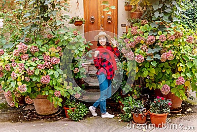 Hipster traveller woman posing in old town of Pienza, Tuscany Stock Photo