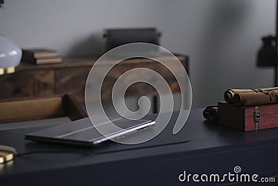 stylish home office details. closed laptop desktop, printable typewriter vintage background Stock Photo