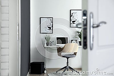 Home office interior, view through open door Stock Photo