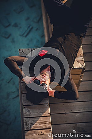 Stylish and independent man lying in the shade Stock Photo