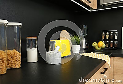 Stylish kitchen counter with houseware, appliances Stock Photo