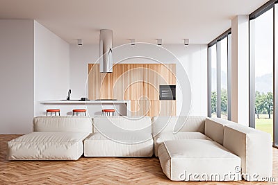 Stylish kitchen interior with countertop, couch and bar chairs near panoramic window Stock Photo