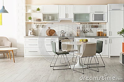 Stylish kitchen interior with dining table Stock Photo