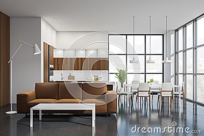 Stylish kitchen set interior with dining table and sofa with coffee table, window Stock Photo