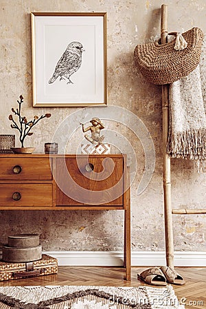Stylish living room with vintage commode, gold mock up photo frame, wooden ladder, bag, plaid, decoration, grunge wall. Editorial Stock Photo