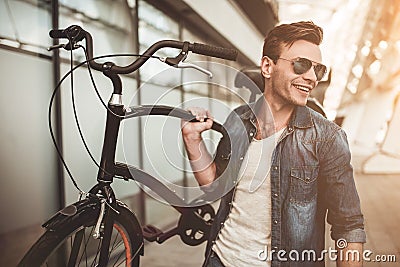 Stylish man with bicycle Stock Photo