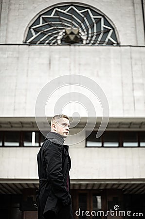 Stylish man in black trenchcoat Stock Photo