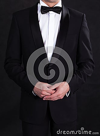 Stylish man in elegant black tuxedo Stock Photo