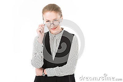 Stylish mature businesswoman looking over eyeglasses Stock Photo