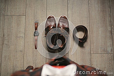 Stylish men& x27;s plaid suit and brown shoes, watch and groom& x27;s belt. Stock Photo